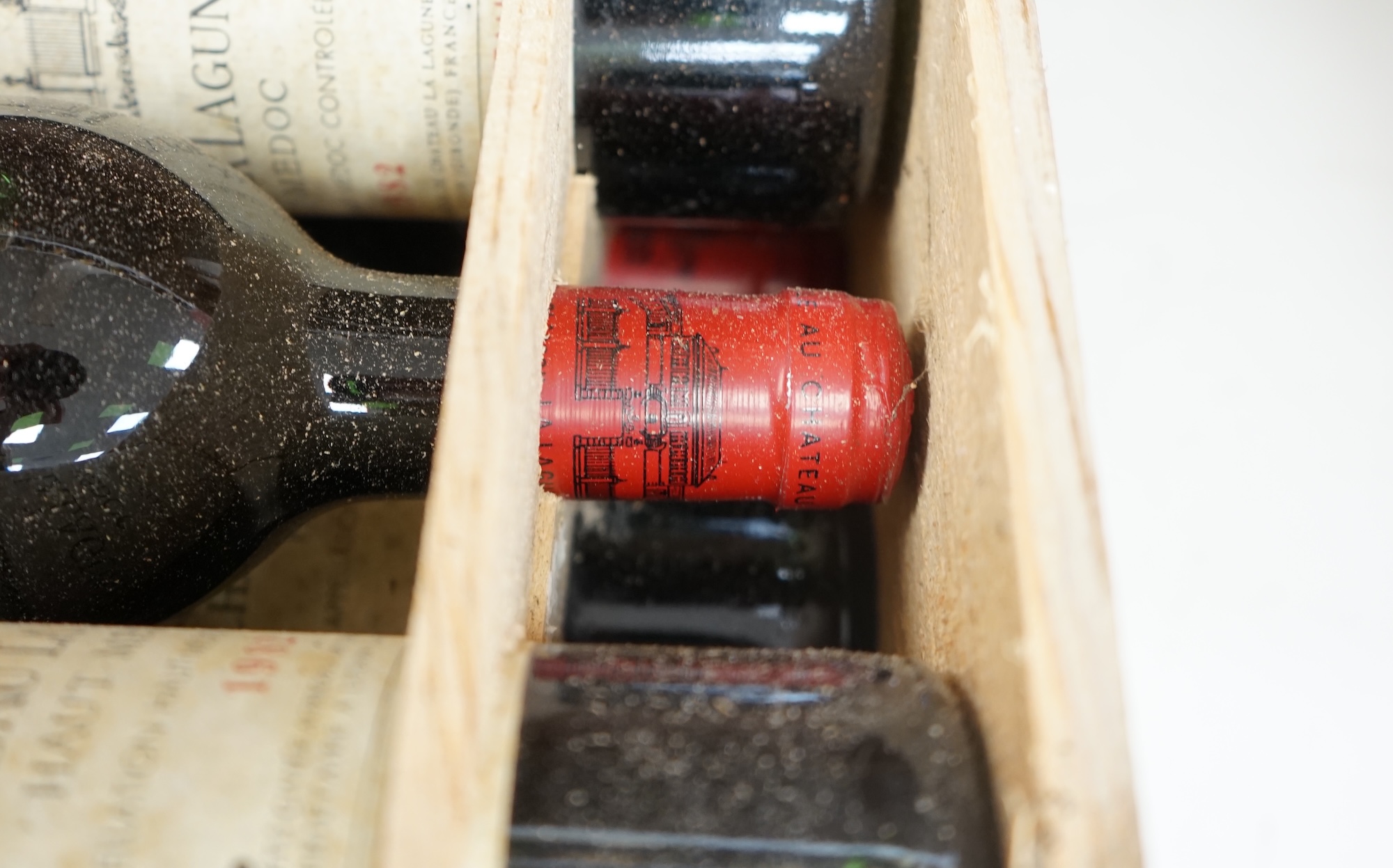 A case of twelve Chateau La Lagune, Haut-Medoc, 1982, France, OWC. Condition - fair, lacking cover. Storage history unknown